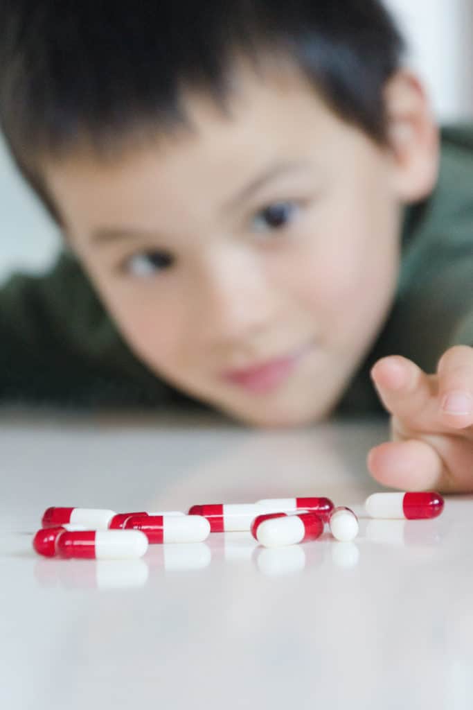 Child in danger with pills